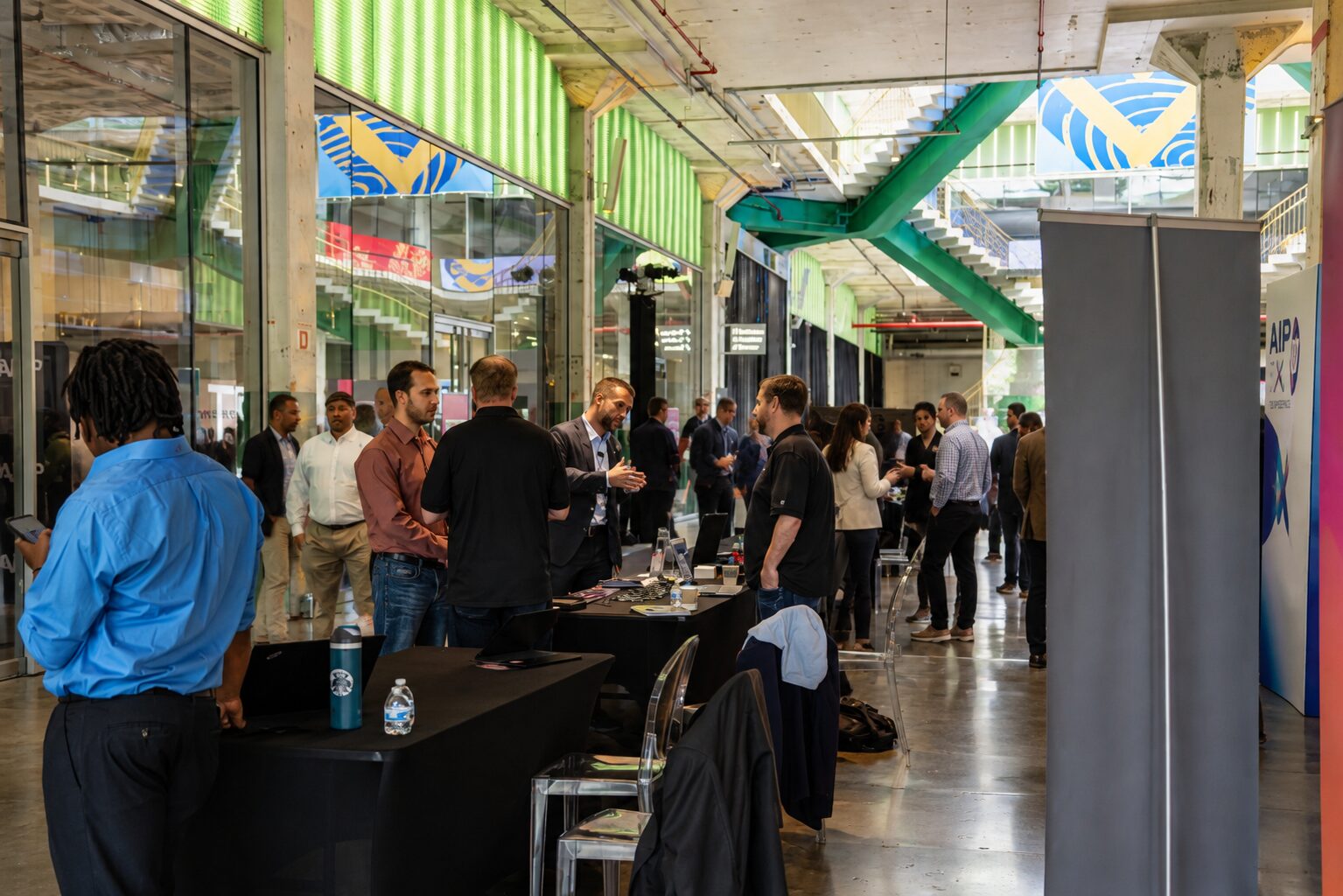 Attendees on the AIXP expo floor